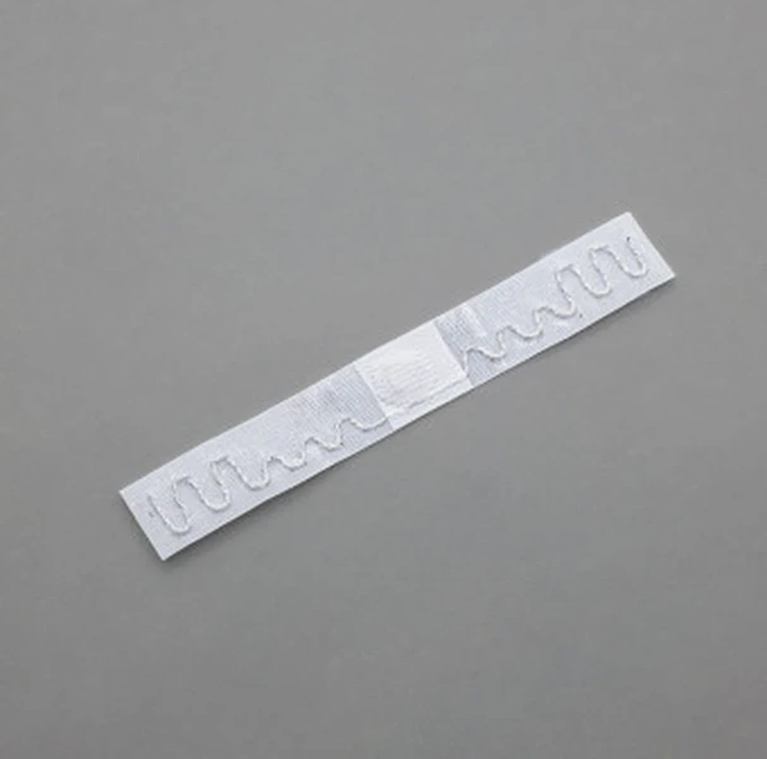 Tag RFID Datamars 70x10 mm Argo Team da inserire nell'orlo dei tessili